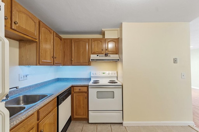 176 Maple Ave Unit 5-5, Rutland, MA 01543 - kitchen with white appliances, ventilation hood, brown cabinetry, light countertops, and light tile patterned floors