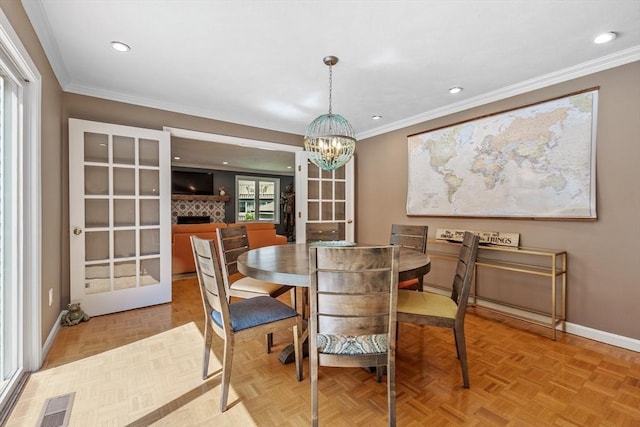 31 Monadnock Dr Unit 31, Westford, MA 01886 - dining area with baseboards, ornamental molding, a chandelier, recessed lighting, and a fireplace