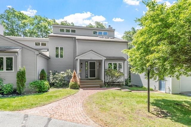 31 Monadnock Dr Unit 31, Westford, MA 01886 - view of front of property featuring a chimney and a front lawn