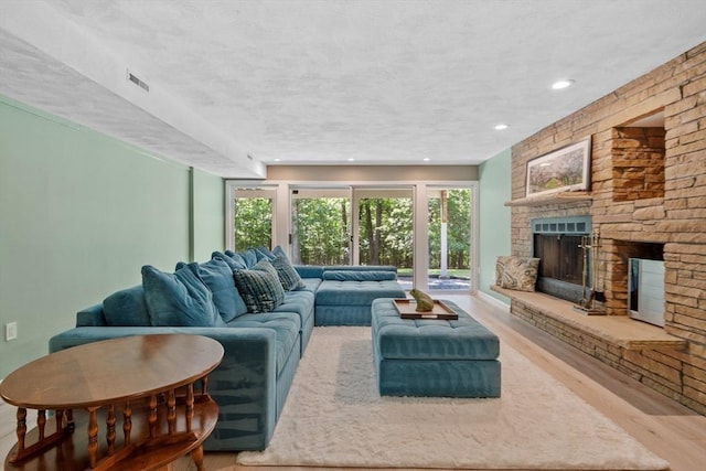 31 Monadnock Dr Unit 31, Westford, MA 01886 - living room featuring wood finished floors, a fireplace, and recessed lighting