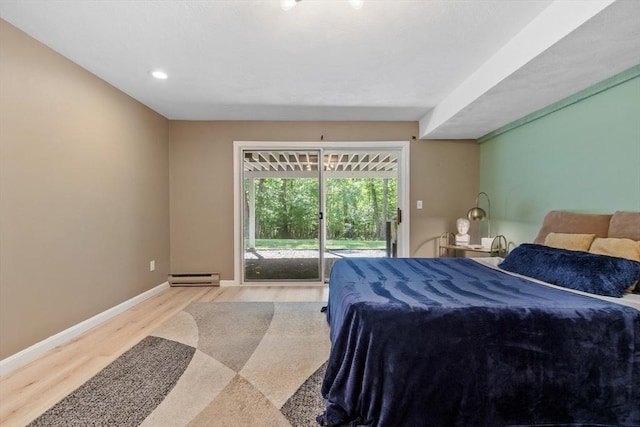 31 Monadnock Dr Unit 31, Westford, MA 01886 - bedroom with baseboard heating, access to exterior, light wood-style flooring, baseboards, and recessed lighting