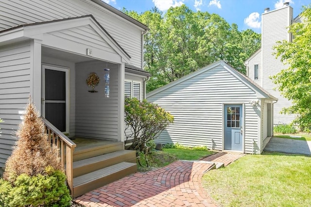31 Monadnock Dr Unit 31, Westford, MA 01886 - view of exterior entry with a lawn