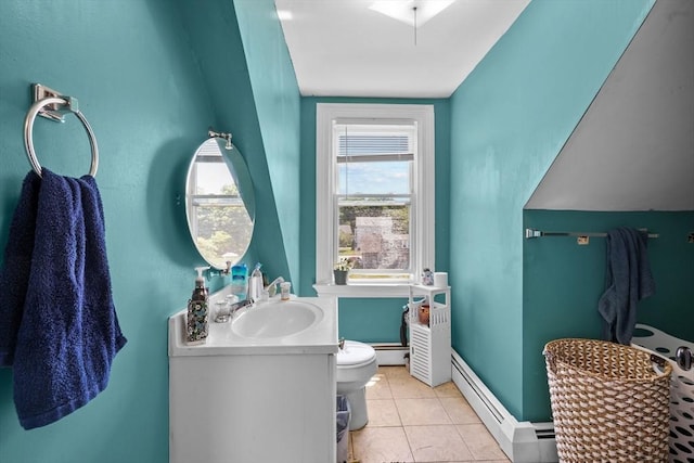 bathroom with tile patterned floors, vanity, toilet, and a baseboard heating unit