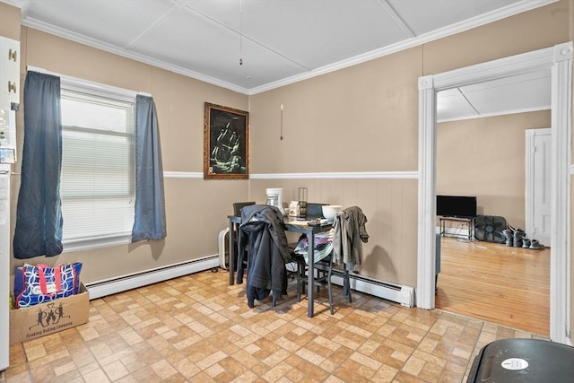 dining space with baseboard heating and crown molding