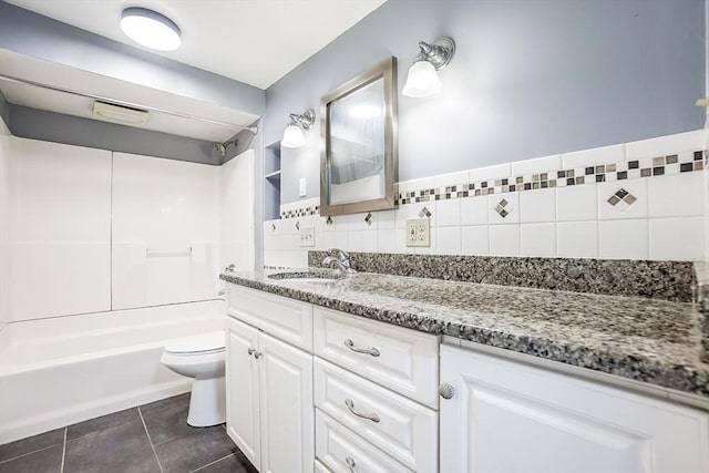 full bathroom with  shower combination, tile patterned flooring, vanity, and toilet