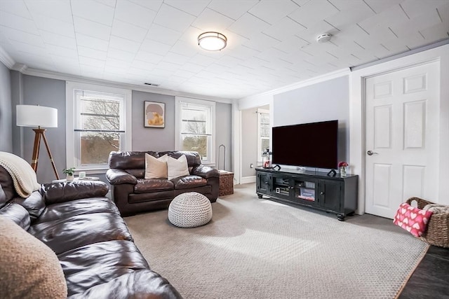 living area featuring carpet floors, ornamental molding, and visible vents