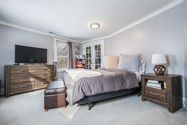 bedroom featuring light carpet, visible vents, crown molding, and french doors