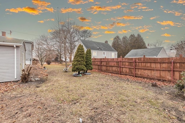 view of yard at dusk