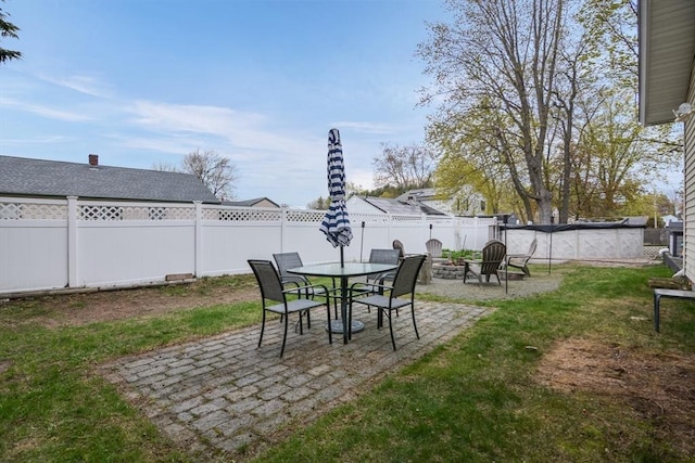 view of yard with a fenced backyard and a patio area