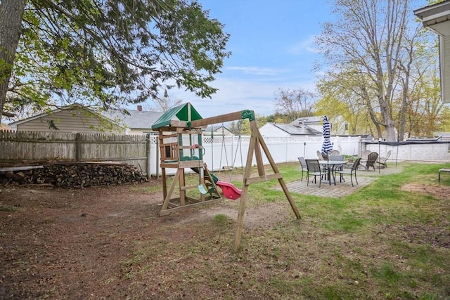 view of jungle gym with a yard and a fenced backyard