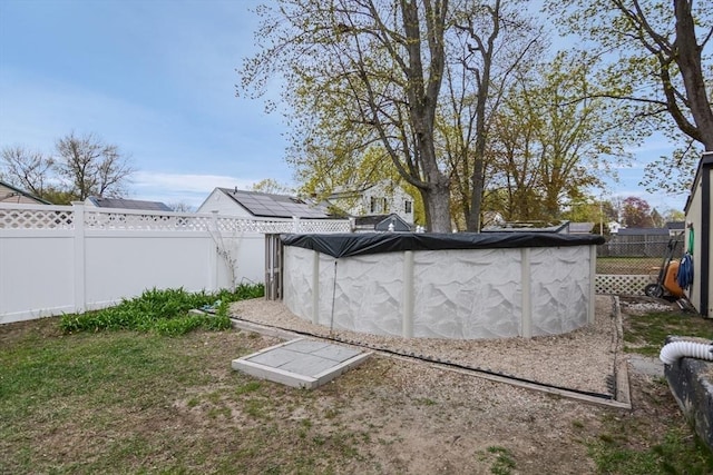 view of yard with a fenced backyard and a fenced in pool