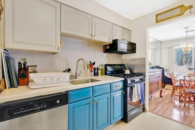 kitchen featuring sink, black appliances, white cabinets, and blue cabinets