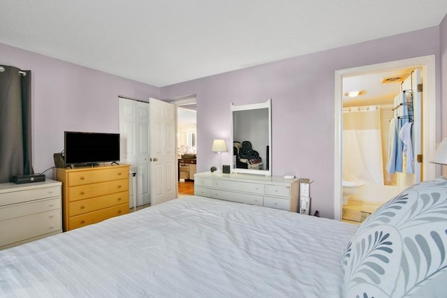 bedroom featuring ensuite bath