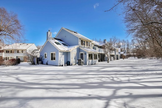 view of snow covered house