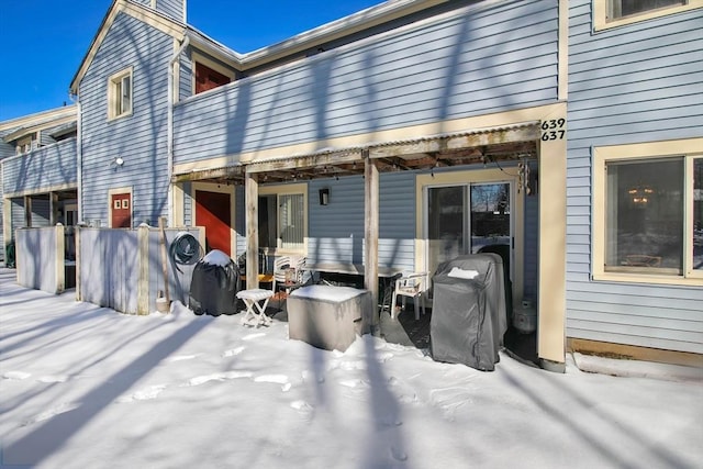 view of snow covered house