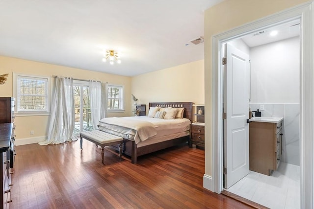 bedroom featuring dark hardwood / wood-style floors and access to outside