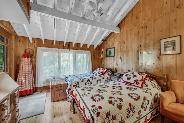 32 Pond Hill Rd, Goshen, MA 01032 - bedroom with multiple windows, wooden walls, and hardwood / wood-style flooring