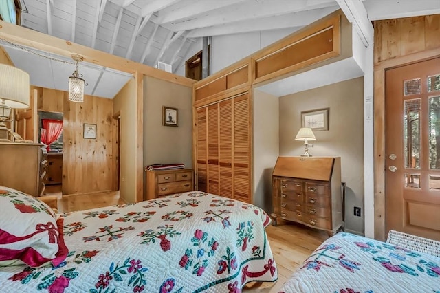 32 Pond Hill Rd, Goshen, MA 01032 - bedroom with a closet, wood finished floors, beam ceiling, high vaulted ceiling, and wood walls