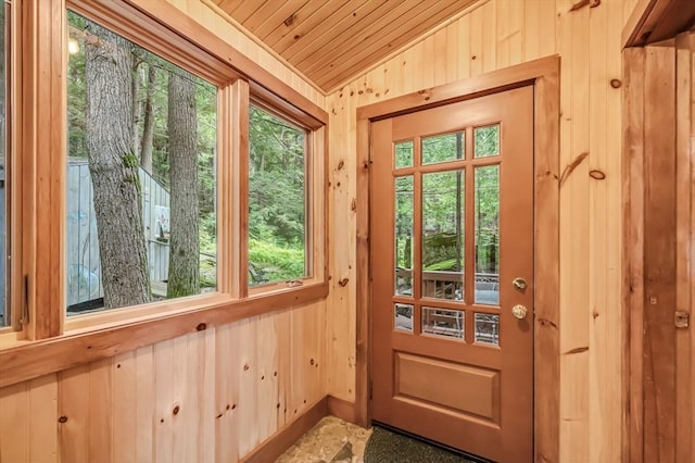 32 Pond Hill Rd, Goshen, MA 01032 - entryway with vaulted ceiling, wood walls, healthy amount of natural light, and wooden ceiling