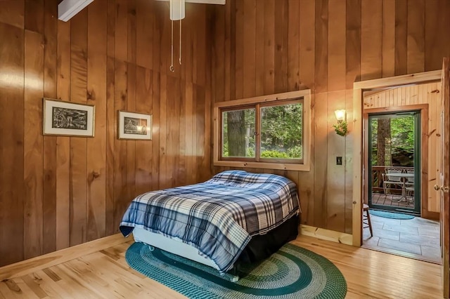 32 Pond Hill Rd, Goshen, MA 01032 - bedroom featuring access to exterior, wood finished floors, wood walls, and a high ceiling