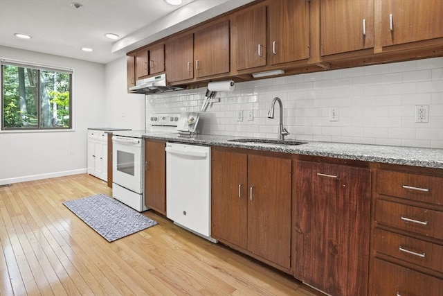 147 Butternut Holw Unit 147, Acton, MA 01718 - kitchen featuring white appliances, a sink, under cabinet range hood, baseboards, and backsplash