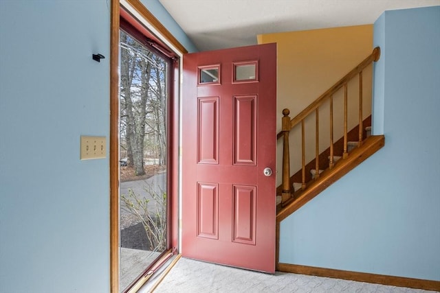 130 Surrey Ln, Brewster, MA 02631 - entryway featuring carpet floors and stairs