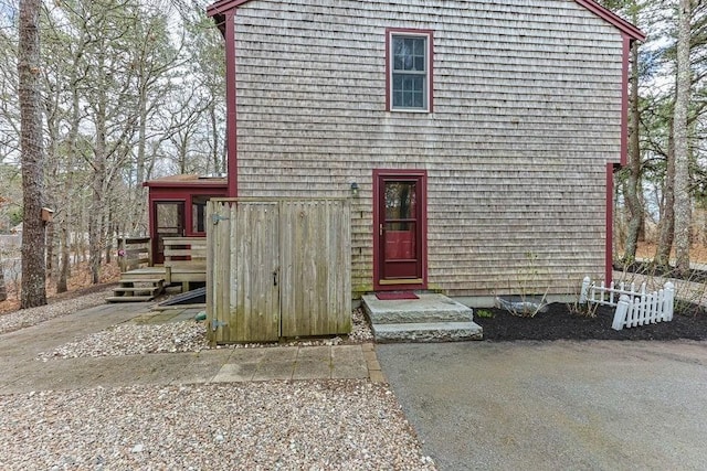 130 Surrey Ln, Brewster, MA 02631 - a-frame home with a wooden deck
