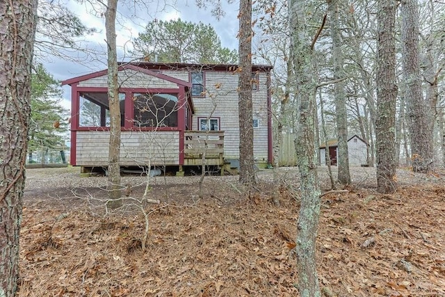 130 Surrey Ln, Brewster, MA 02631 - exterior space with a wooden deck and an outbuilding