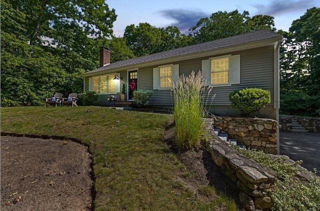15 Surrey Ln, Sandwich, MA 02563 - view of front of property featuring a chimney and a front yard