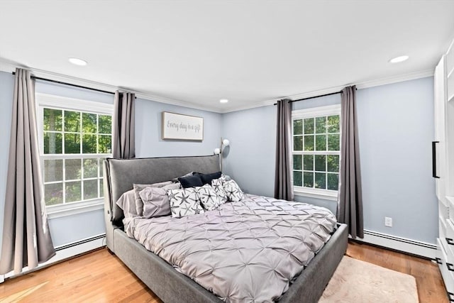 15 Surrey Ln, Sandwich, MA 02563 - bedroom featuring ornamental molding, a baseboard radiator, multiple windows, light wood-style flooring, and recessed lighting