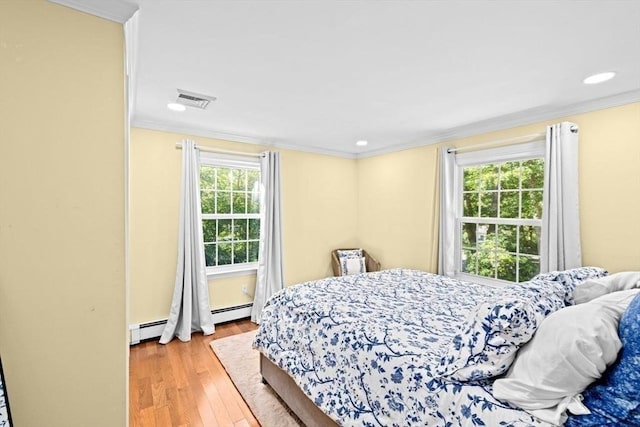 15 Surrey Ln, Sandwich, MA 02563 - bedroom with a baseboard radiator, ornamental molding, wood finished floors, and recessed lighting
