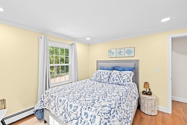 15 Surrey Ln, Sandwich, MA 02563 - bedroom with a baseboard heating unit, wood finished floors, recessed lighting, and crown molding
