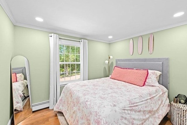 15 Surrey Ln, Sandwich, MA 02563 - bedroom featuring a baseboard radiator, wood finished floors, crown molding, and recessed lighting