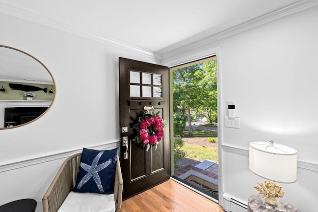 15 Surrey Ln, Sandwich, MA 02563 - foyer entrance with ornamental molding, wainscoting, light wood-type flooring, and baseboard heating