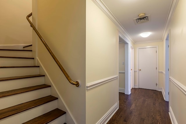 interior space with wood-type flooring and crown molding