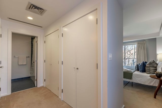 hallway with light carpet