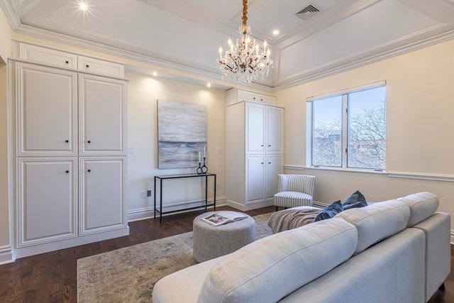 living room with a chandelier, dark hardwood / wood-style floors, and crown molding