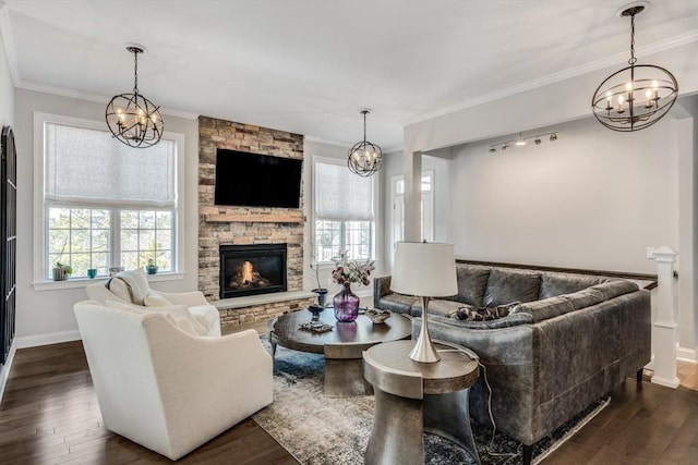 living area with ornamental molding, plenty of natural light, and dark wood finished floors