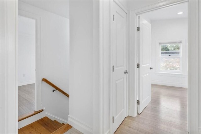 7 New Bridge St, Hingham, MA 02043 - corridor with an upstairs landing, light wood finished floors, and baseboards