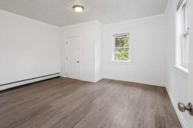 7 New Bridge St, Hingham, MA 02043 - unfurnished room with wood finished floors, crown molding, baseboards, and baseboard heating
