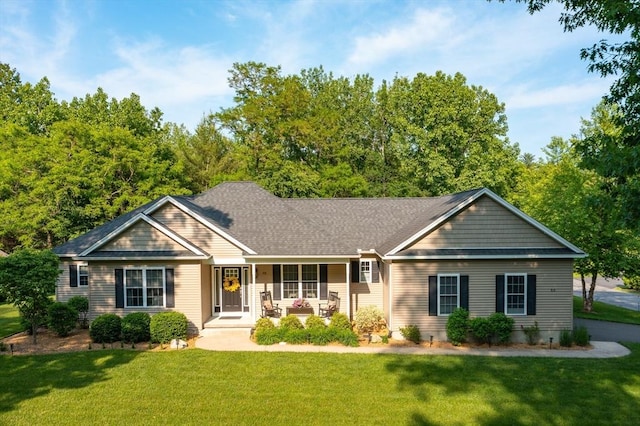53 Gilbert Rd, Southampton, MA 01073 - ranch-style home with a porch and a front lawn