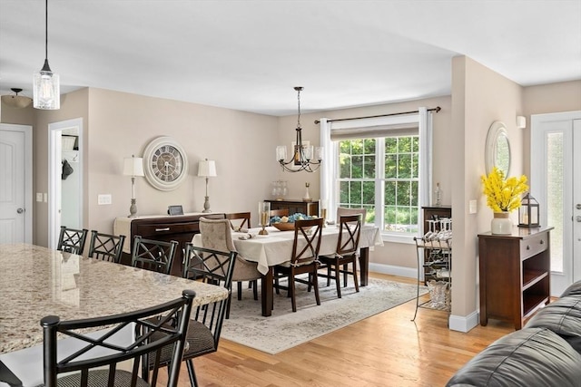 53 Gilbert Rd, Southampton, MA 01073 - dining area featuring light wood-style flooring, baseboards, and a chandelier