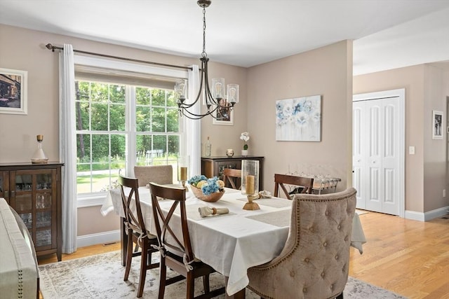 53 Gilbert Rd, Southampton, MA 01073 - dining area with a chandelier, baseboards, and light wood-style floors