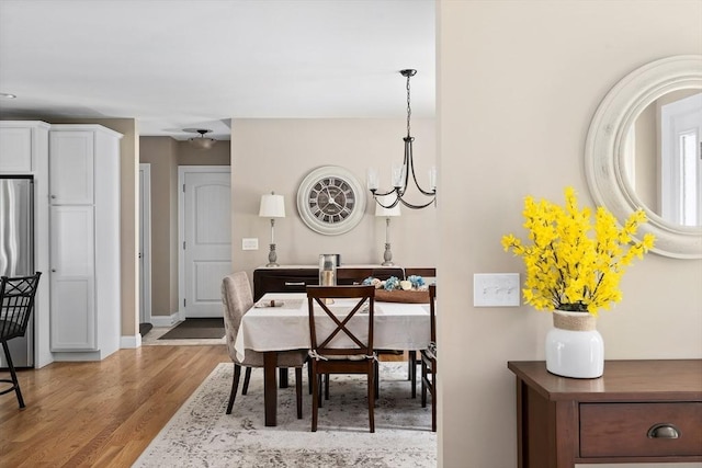 53 Gilbert Rd, Southampton, MA 01073 - dining area with wood finished floors, a chandelier, and baseboards