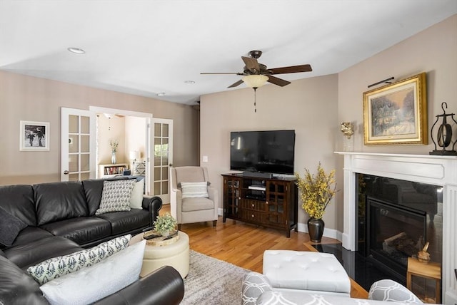 53 Gilbert Rd, Southampton, MA 01073 - living room with wood finished floors, a ceiling fan, french doors, a premium fireplace, and recessed lighting
