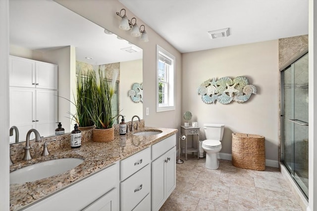 53 Gilbert Rd, Southampton, MA 01073 - bathroom featuring double vanity, a shower stall, toilet, and baseboards