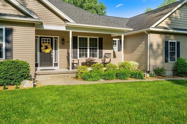 53 Gilbert Rd, Southampton, MA 01073 - entrance to property with covered porch, a lawn, and roof with shingles