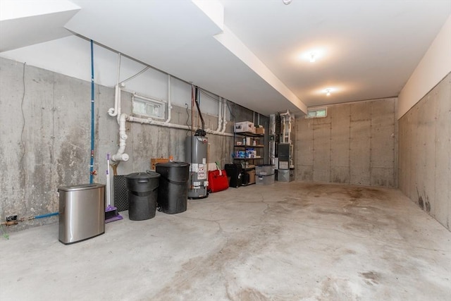 unfinished basement featuring water heater