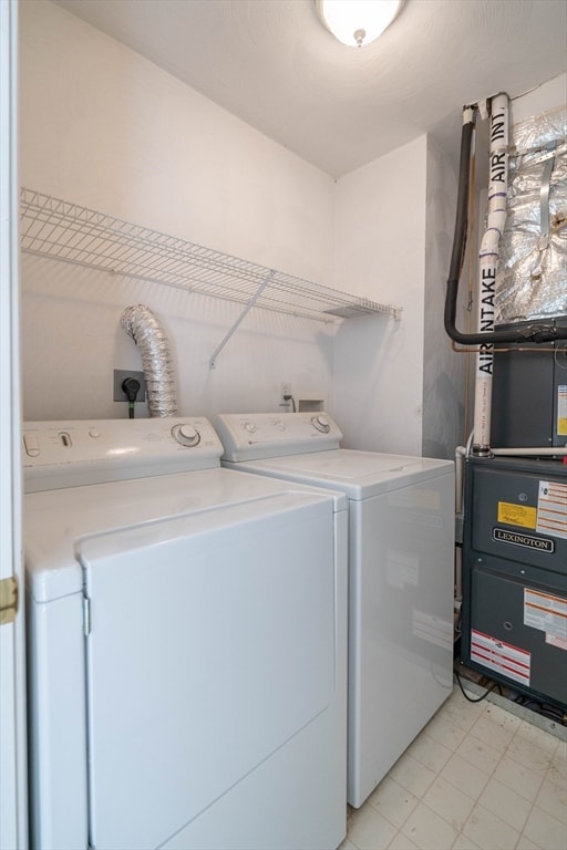 laundry area with washing machine and dryer