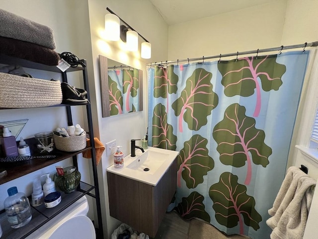 bathroom with a shower with curtain and vanity